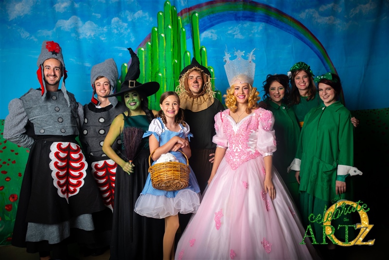 Group of actors dressed in costume for a theatrical performance of Wizard of Oz