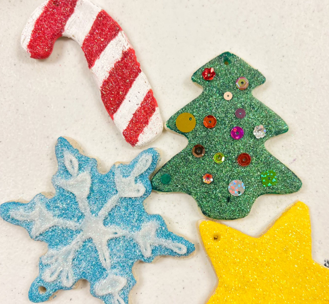 Handmade Christmas ornaments made out of clay, glitter and sequins.